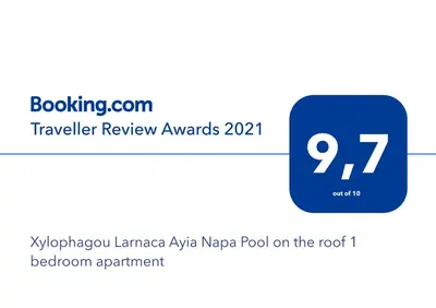 a screenshot of the kyrgyzlanguage kaya napaya pool on at Xylophagou Larnaca Ayia Napa 1 bedroom apartment in Xylophaghou