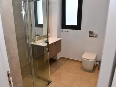 a bathroom with a glass shower and a toilet at BAZ TOWER in Nicosia