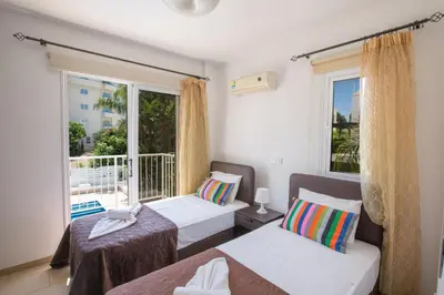 a bedroom with two beds and a window at Protaras View Villa 5 in Protaras