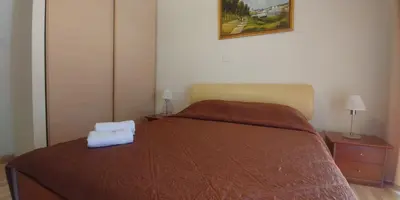 a bedroom with a bed with a towel on it at Palm beach 14 in Limassol