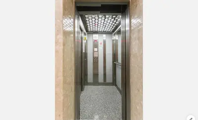a hallway leading into a building with a glass door at Mediterranean dream in Voroklini