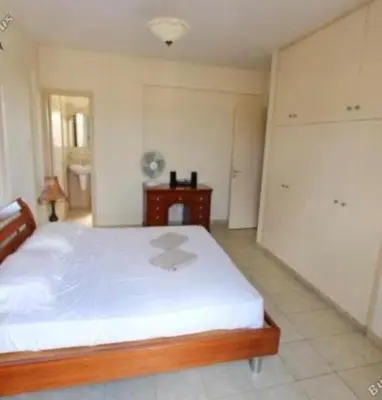 a bedroom with a large bed in a room at Sunrise Villa in Ayia Napa