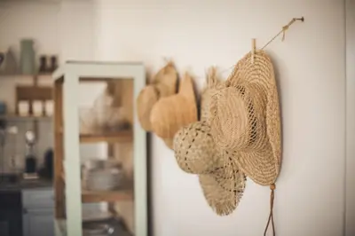 a group of hats hanging on a wall at Ayia Napa Villa Danae in Ayia Napa
