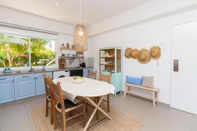 a kitchen with a table and chairs in a room at Ayia Napa Villa Danae in Ayia Napa