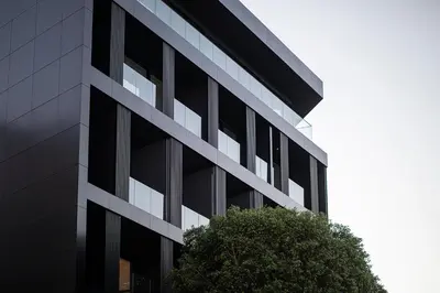 an office building with a tree in front of it at MAP Boutique Hotel in Nicosia