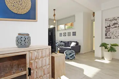 a living room with a fireplace and a couch at Villa Lily in Protaras