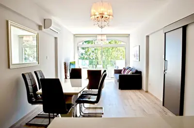 a dining room with a table and chairs at Galatex Sea Breeze in Limassol