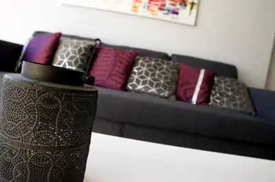 a couch with pillows on it in a living room at Galatex Sea Breeze in Limassol