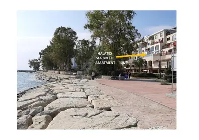 a yellow frisbee is flying over a stone walkway at Galatex Sea Breeze in Limassol