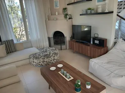 a living room with a couch and a coffee table at Saint John Sia house in Nicosia