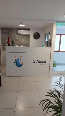 a counter in a kitchen with a clock on the wall at La Veranda Hotel in Larnaka