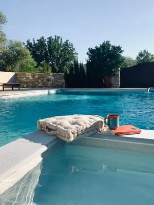 a mattress sitting on the edge of a swimming pool at The Goathouse in Larnaka