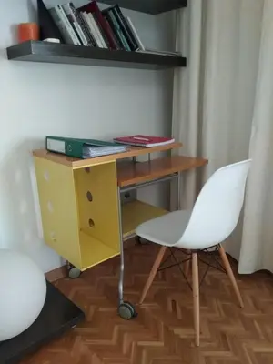a desk and a chair in a room at Seaside Spacious Apartment with Sea View in Limassol