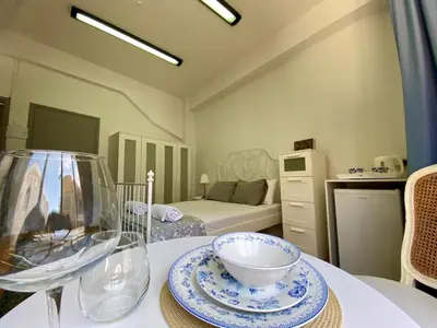 a room with a table with a bowl on it at Unique Studios Phaneromenis 41 - Down Town Nicosia in Nicosia