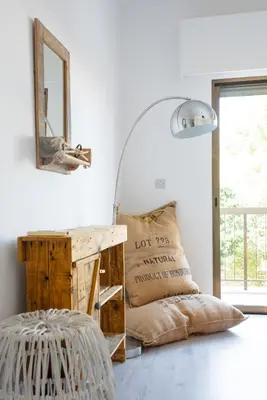 a room with a mirror and a table with a pillow at Sun city apartment in Limassol