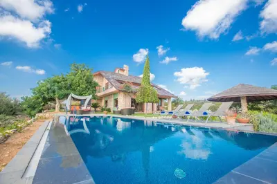 a swimming pool in front of a house at Villa Othelo in Ayia Napa