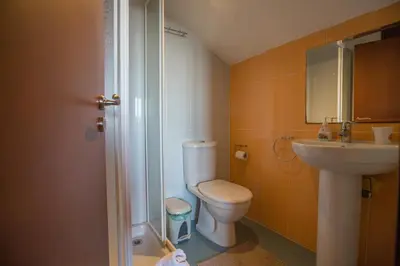a bathroom with a toilet and a sink at Villa Joy in Protaras