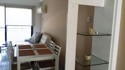 a room with a table and a dining room at Krasas Beach Apartments in Larnaka