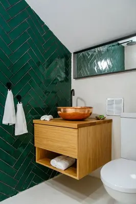 a bathroom with a wooden sink and a toilet at Island Home Seaside Villa in Paralimni