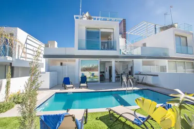 an image of a house with a swimming pool at Oli Vine Villas in Protaras