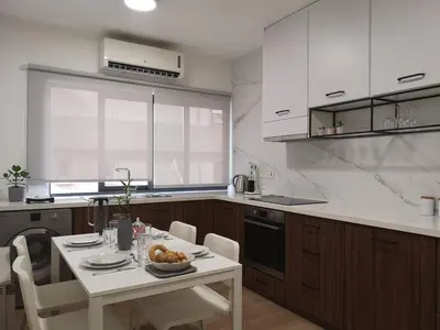 a kitchen with a table with a bowl of food on it at Nemesis in Larnaka