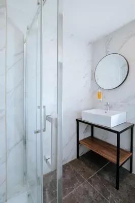 a bathroom with a sink and a mirror at Cosmo Napa Boutique Hotel in Ayia Napa