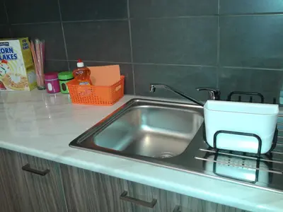 a kitchen sink with a white pot on it at Elenapa Holiday Apartments in Ayia Napa