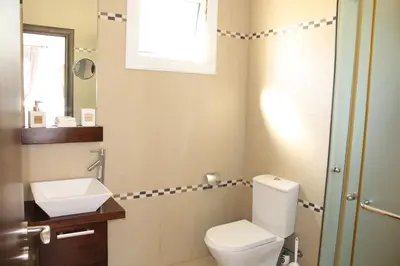 a bathroom with a toilet and a sink at Natali villa in a perfect location in Paralimni