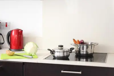 a kitchen counter with pots and pans on a stove at Natali villa in a perfect location in Paralimni