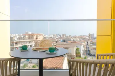 a table with two cups on top of a window at Hotel Indigo Larnaca by IHG-ADULTS ONLY in Larnaka