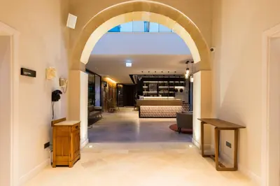 an archway leading to a tasting room in a building at Hotel Indigo Larnaca by IHG-ADULTS ONLY in Larnaka