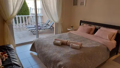 a bedroom with a bed with two pillows on it at Nissi Golden Sands Holiday Apartment Free WiFi in Ayia Napa