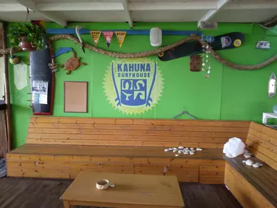 a restaurant with a wooden bench and a table at MERSINERA Paradise Garden 2 in Larnaka