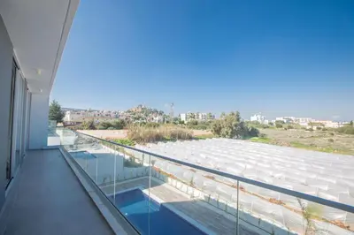 a balcony of a building with a view of the water at Protaras Olivine Villa OL17 in Protaras