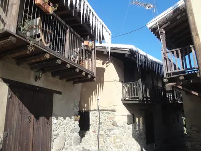 an old building with wooden balconies on the side of it at Irene's House in Kakopetria