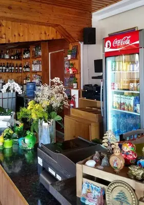 a cocacola soda machine in a kitchen with a counter at Myriama Apartments in Ayia Napa