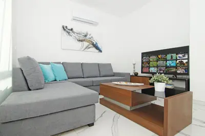 a living room with a couch and a coffee table at Villa Paradisia in Ayia Napa