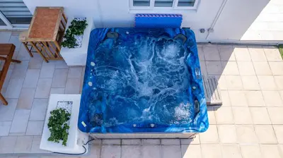 an overhead view of a blue tub in a backyard at Dene Hollow Oroklini in Voroklini