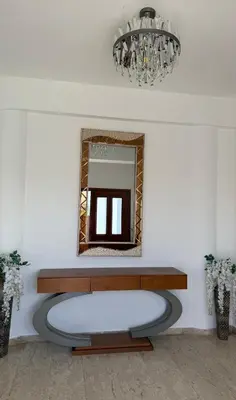 a mirror and a bench in a room at Dene Hollow Oroklini in Voroklini