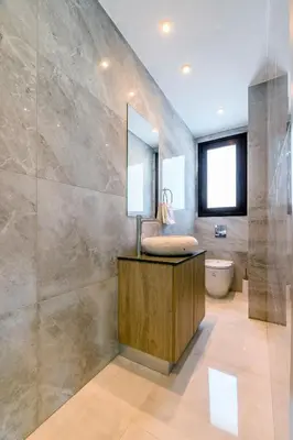 a bathroom with a sink and a mirror at Serenity Seafront Villa in Ayia Napa