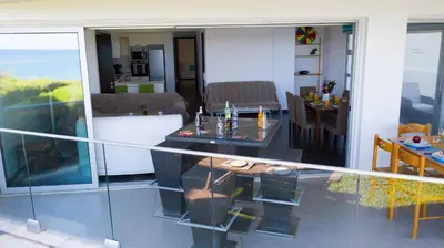 a living room with a table and a dining room at Apartment Trident 4 in Paralimni