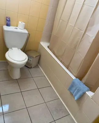 a bathroom with a toilet and a shower at Ayia Napa Sun Central in Ayia Napa