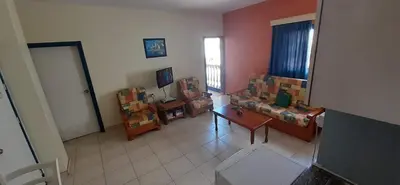 a living room with a couch and a table at Ayia Napa Sun Central in Ayia Napa