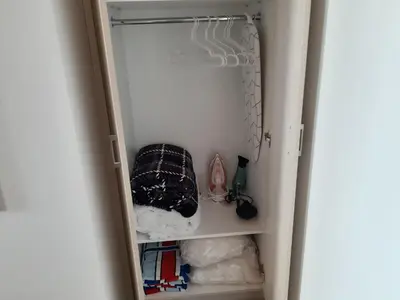 a closet with a door open to a closetploadermottermott at ZORBAS Sea View No 5 in Larnaka