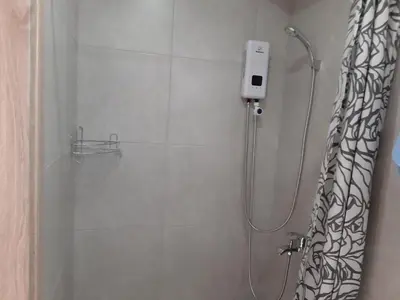 a shower in a bathroom with a shower curtain at ZORBAS Sea View No 5 in Larnaka