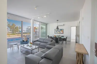 a living room with a couch and a table at Villa Naya in Protaras