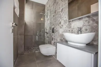 a bathroom with a sink and a toilet at Villa Naya in Protaras