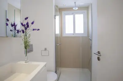 a bathroom with a shower and a toilet and a sink at Central Protaras Seaview Villa Zinnia in Protaras