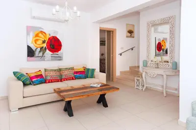 a living room with a couch and a coffee table at Villa Katherine - Nissi Beach Area in Ayia Napa
