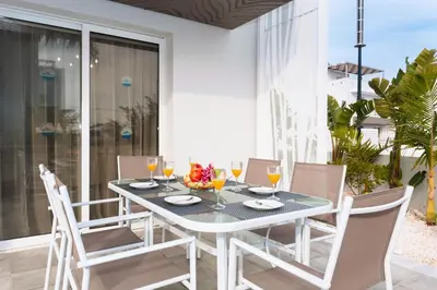 a dining room with a table and chairs at Villa Katherine - Nissi Beach Area in Ayia Napa